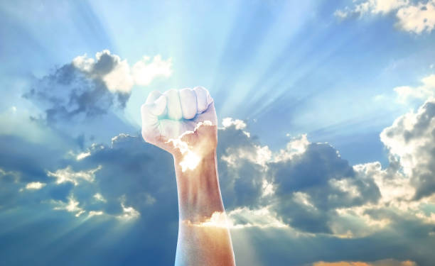 istock fist strong and sunrise 2054815390