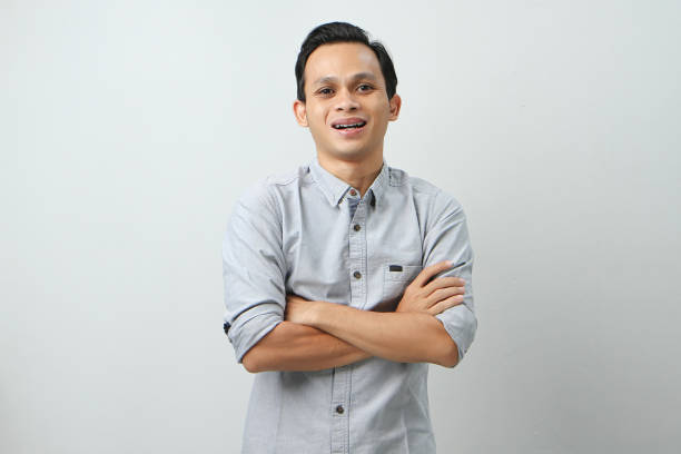 istock happy confident asian indonesian man on isolated background 2054815469
