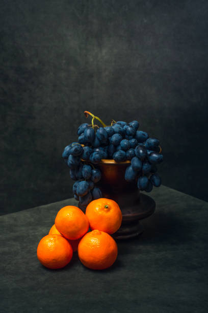 istock Still life with tangerines and grapes 2054815481