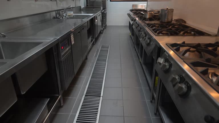 Interior shot of a professional restaurant's kitchen. New stainless steel commercial kitchen. - Professional Cooking School