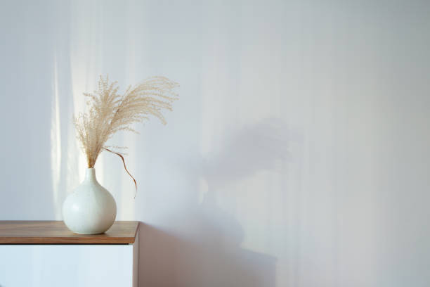 istock dry cereal ornamental plants in vase on background white wall 2054861579