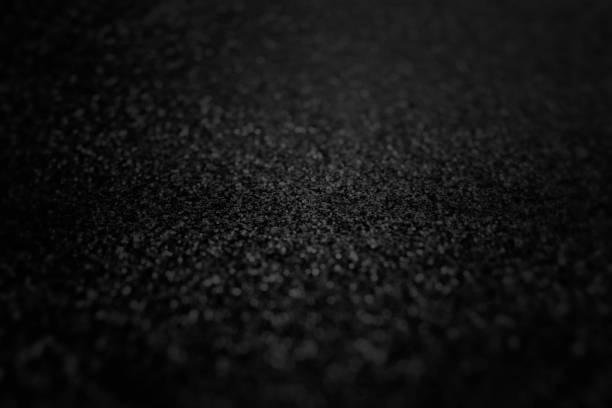 Dark texture backgrounds with spotlight. Studio shot.