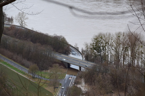 Namedy, Germany - 01/05/2024: Rhine flood blocking a lower road, upper one empty