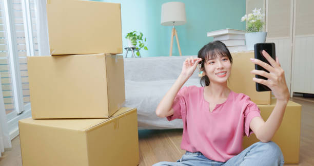 istock woman happily new home keyring 2054940550