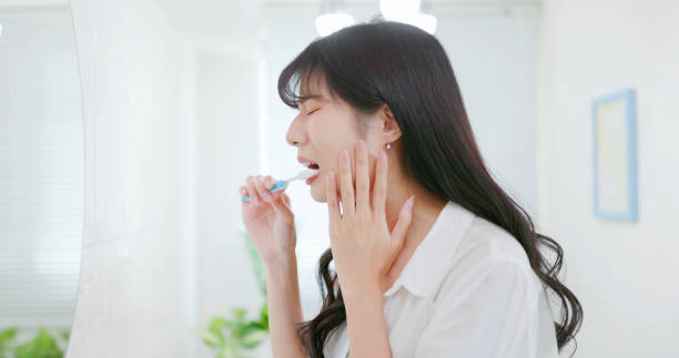 istock asian woman feels tooth ache 2054943693