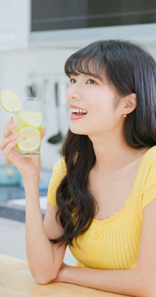 istock asian woman enjoy drink lemonade 2054944201