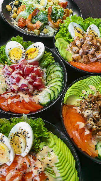 istock Vegetable and fish salad with tomatoes, cucumbers and avocado. Boiled egg. Bowl. 2054961498