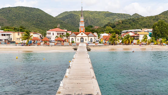 The View Diminishes as the Jetty Extends Towards the Distant Church on the Beach,Framed by Towering Mountains,a Serene Scene that Encapsulates the Tranquility and Majesty of the Coastal Landscape,Inviting Contemplation amidst the Beauty of Nature's Embrace.