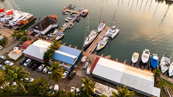 From a Lofty Vantage Point,the Harbor Reveals a Bustling Scene,with Boats and Cars Bustling against the Backdrop of the Setting Sun,Casting a Golden Glow Over the Waterfront,a Spectacle of Urban Life.
