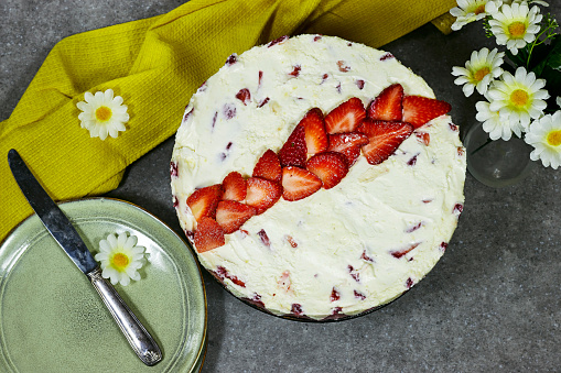 strawberry cake or Fraisier in french language with daisy flowers
