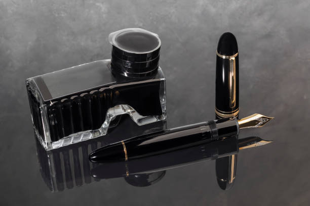 istock Fountain pen on marble and gray background with reflection. Vibration focus. 2054981068
