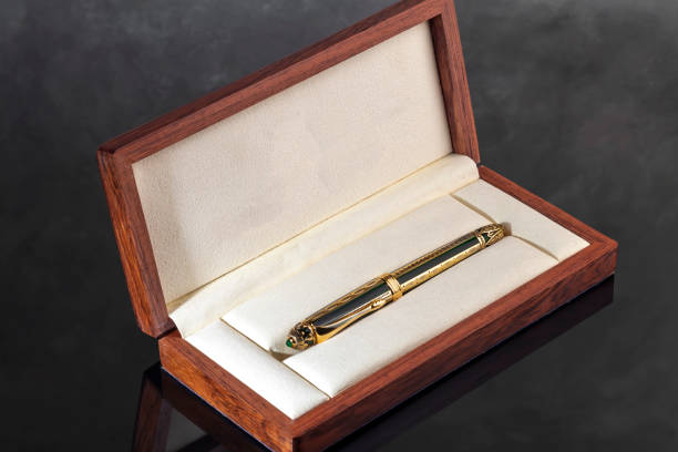 istock Fountain pen on marble and gray background with reflection. Vibration focus. 2054981591