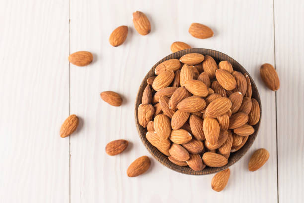 istock Raw peeled almonds in brown bowl 2055003091