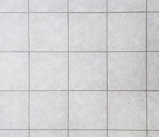 istock High angle view of grey tiles texture background. 2055022634