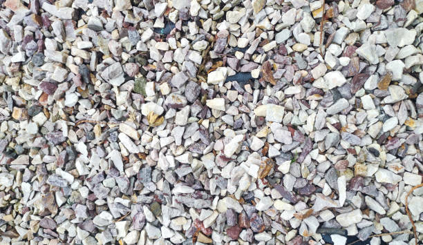 istock Close-up shot of small gravel pattern on a road surface. 2055022647