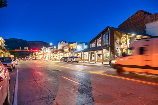Jackson Hole, WY - July 11, 2019: City streets and cars at sunset.