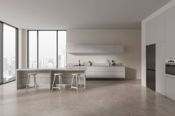 istock Beige home kitchen interior with bar island and cooking cabinet, window 2055022777