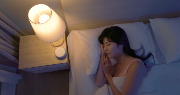 istock asian woman use white noise 2055024524