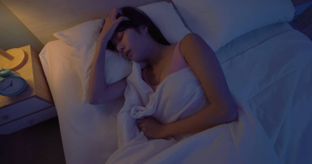istock asian woman sleepless at night 2055025442