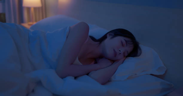 istock asian woman night sleep deeply 2055028095