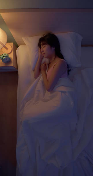 istock asian woman night sleep deeply 2055028635