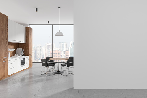 White and wooden office kitchen interior with tables and chairs. Cooking cabinet with shelves and panoramic window on Singapore skyscrapers. Mock up copy space empty wall. 3D rendering
