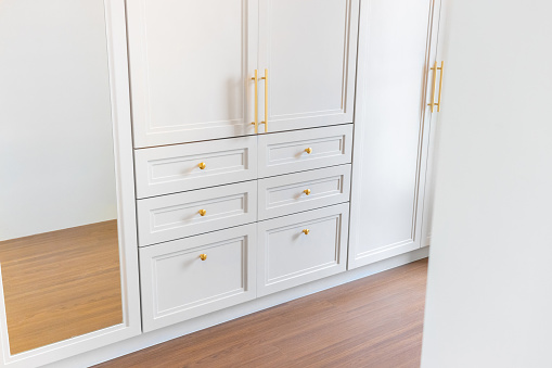 Luxurious white and gold wooden cabinet