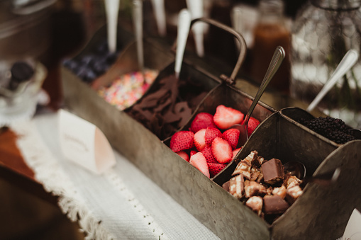 Ice cream toppings of chocolate, fruit and sprinkles candy