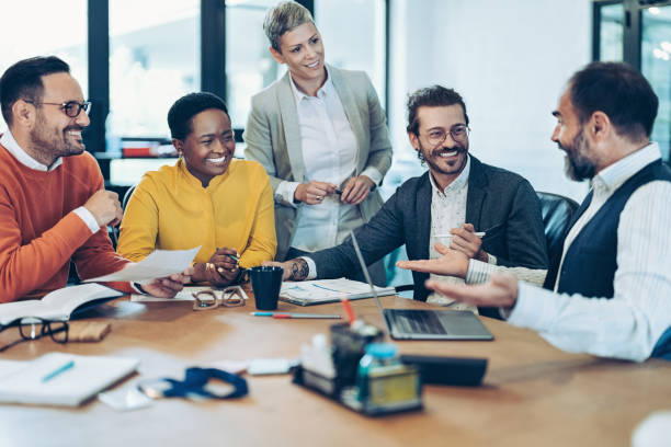 istock Experienced businessman talking to his younger colleagues 2055040848