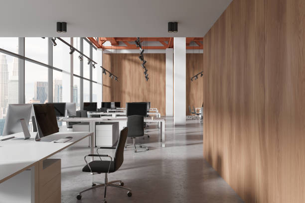 istock Business office interior with desk and pc desktop in row, panoramic window 2055045082
