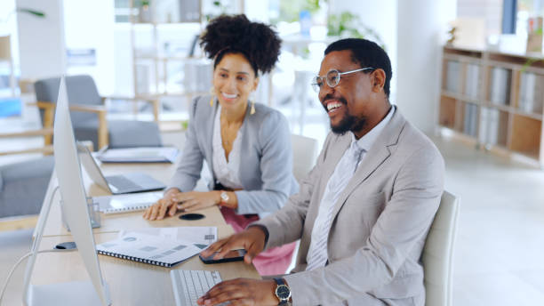 istock Man, woman and office with computer, working and collaboration for strategy, team and planning. Business partners, conversation or brainstorming for project, company or agency for happy, smile or job 2055057246