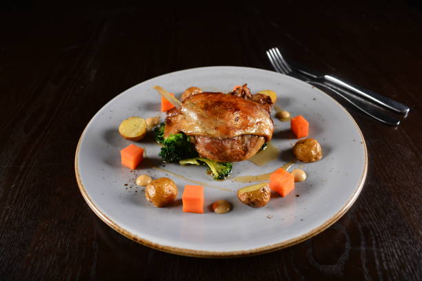 istock chef western marinated grilled duck leg confit with vegetables and sauce main course in plate on white table western restaurant asian halal cafe hotel menu 2055064595