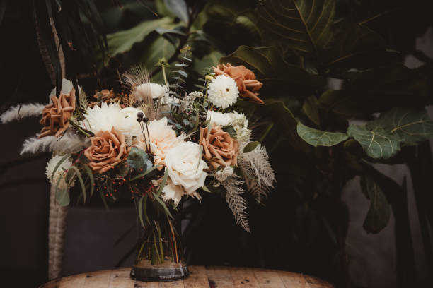 istock Autumn colored wedding bouquet for bride in a vase 2055071655