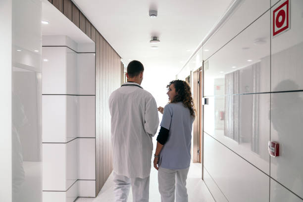 istock Back View of Medical Discussion in Hospital Setting 2055101038