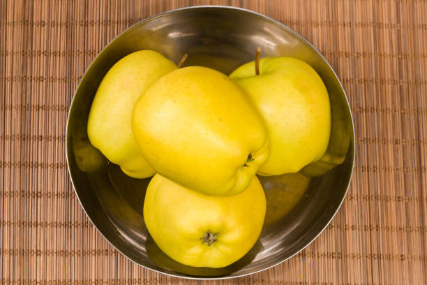 Fresh Yellow Apples Arranged on a Decorative Plate