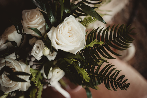 Winter wedding bouquet for bride of white flowers and greenery