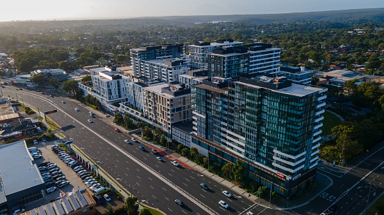 Aerial drone view of commercial and residential buildings at Kirrawee in the Sutherland Shire, South Sydney, NSW Australia during a sunny morning in March 2024