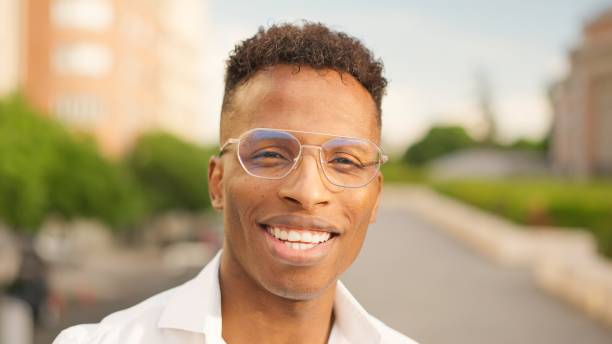 istock African man looks at camera and smiles 2055155349