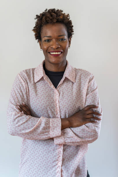 istock Woman standing with arms crossed 2055159612