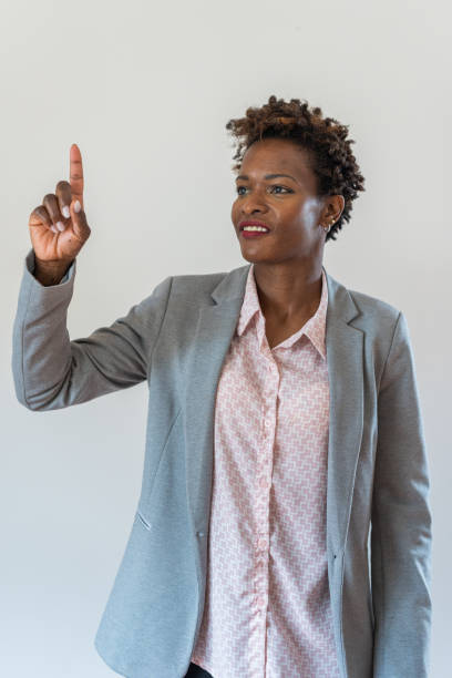 istock Business woman pointing upward 2055162238