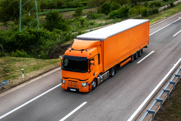 istock Orange Transportation Truck on road 2055167480