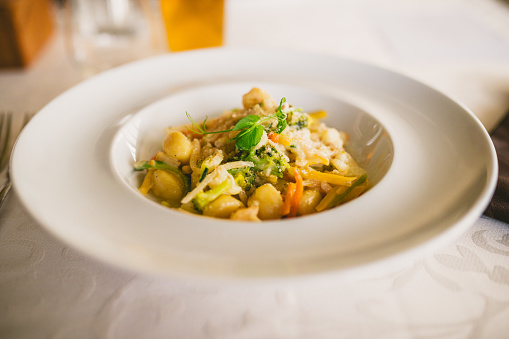 Gnocchi with vegetables on a plate