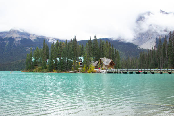 Beautiful houses on Lake Emerld in Canada on a cloudy day.