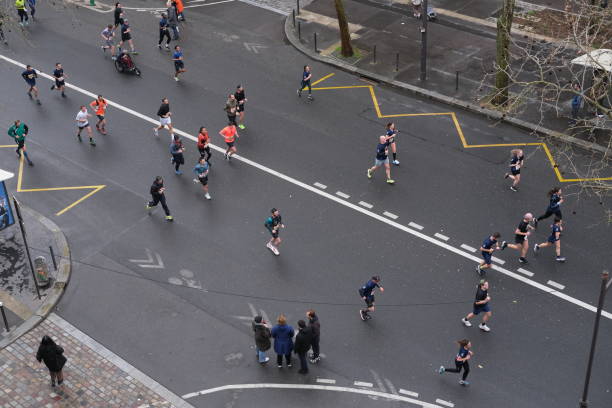 Lady and gent runners competing on a gloomy Budapest day, Hungary.