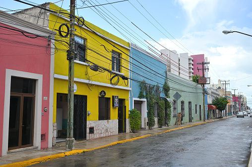 Merida, Mexico - July 20, 2023: Colorful colonial style buildings at street of Merida city old town, Yucatan, Mexico