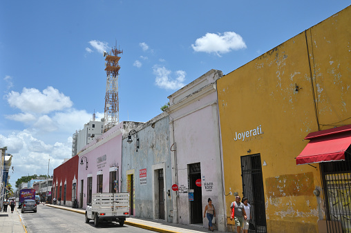Merida, Mexico - July 21, 2023: Colorful colonial style buildings at street of Merida city old town, Yucatan, Mexico