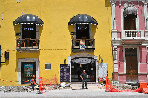 Merida, Mexico - July 20, 2023: Colorful colonial style buildings at street of Merida city old town, Yucatan, Mexico