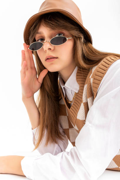 istock A girl in a formal suit in the studio. 2055302578
