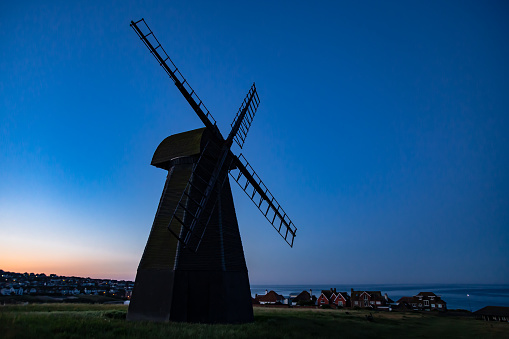 Low angle view of a traditional Dutch windmill against sky
