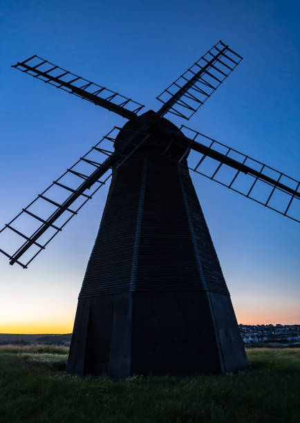 Early morning in June Pitstone windmill behind a golden wheat field Buckinghamshire south east England
